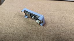 A back view of the 3D printed case, sitting on a table